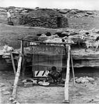 Navajo weaver shown in 'natural setting' - actually a staged setting for tourists - paid 'demonstrators'