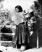 Navajo woman with child - many tourists from the Santa Fe train line took pictures of Navajos - This is circa pre-War